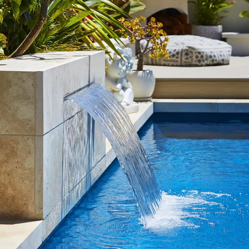 Compact Fibreglass Pool Water Feature Water feature beside a compact fibreglass pool