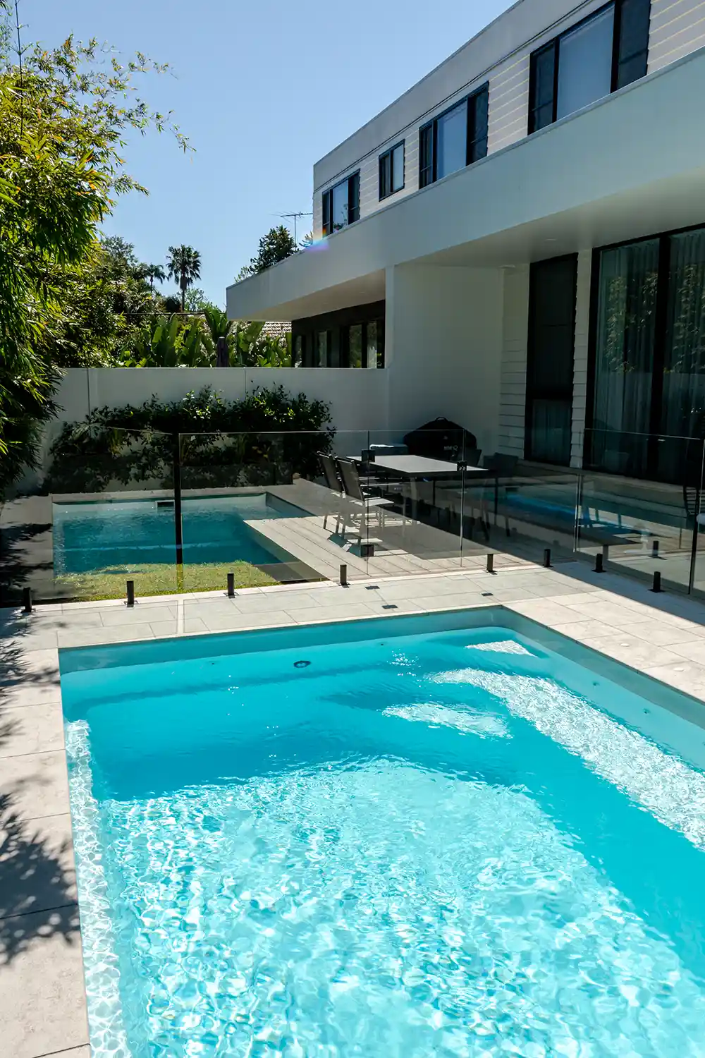 Heron Series Compact Fibreglass Pool Design Heron Series compact fibreglass pool in a contemporary outdoor entertaining area