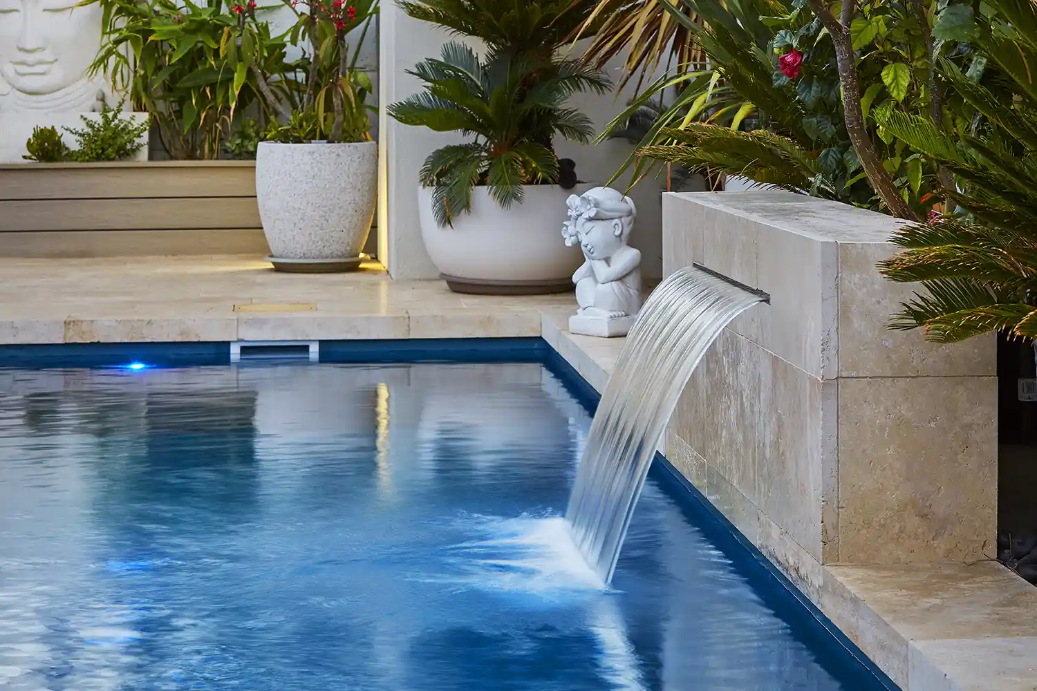 Compact Fibreglass Pool Water Feature Water feature integrated into a compact fibreglass pool
