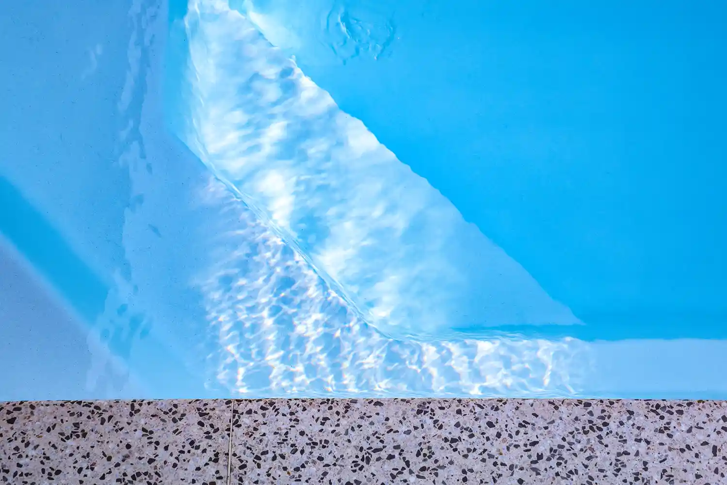 Heron Series Pool Detail Close-up of the Heron Series pool entry step and interior finish