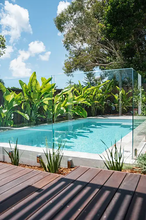 Custom concrete swimming pool with tropical landscaping on the Sunshine Coast
