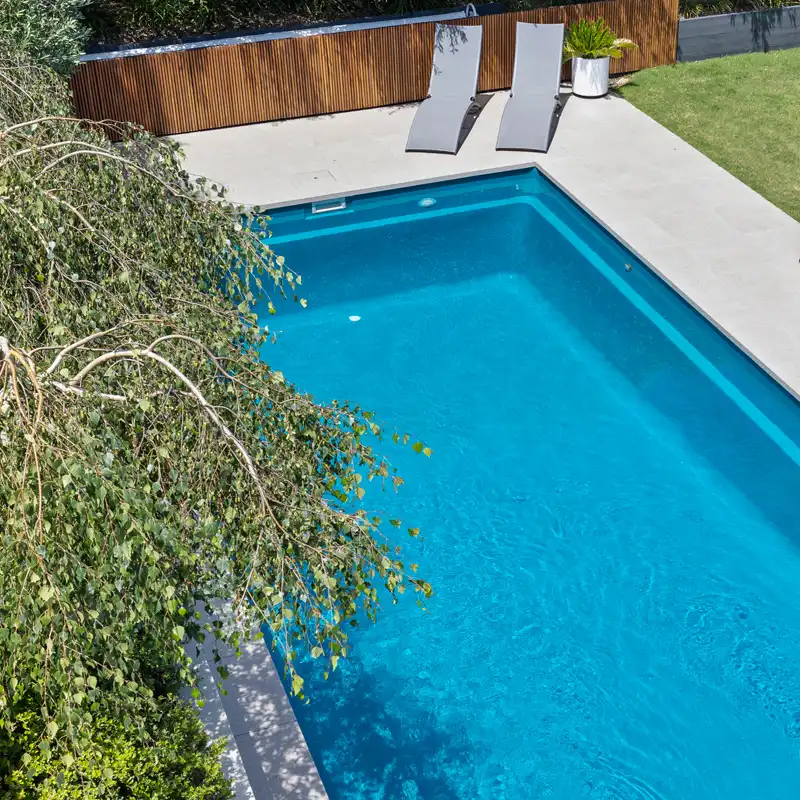 Bribie Island Pool Builder | Fibreglass Swimming Pool | Monsoon Pools Modern fibreglass swimming pool built by a Bribie Island pool builder for a coastal Queensland home