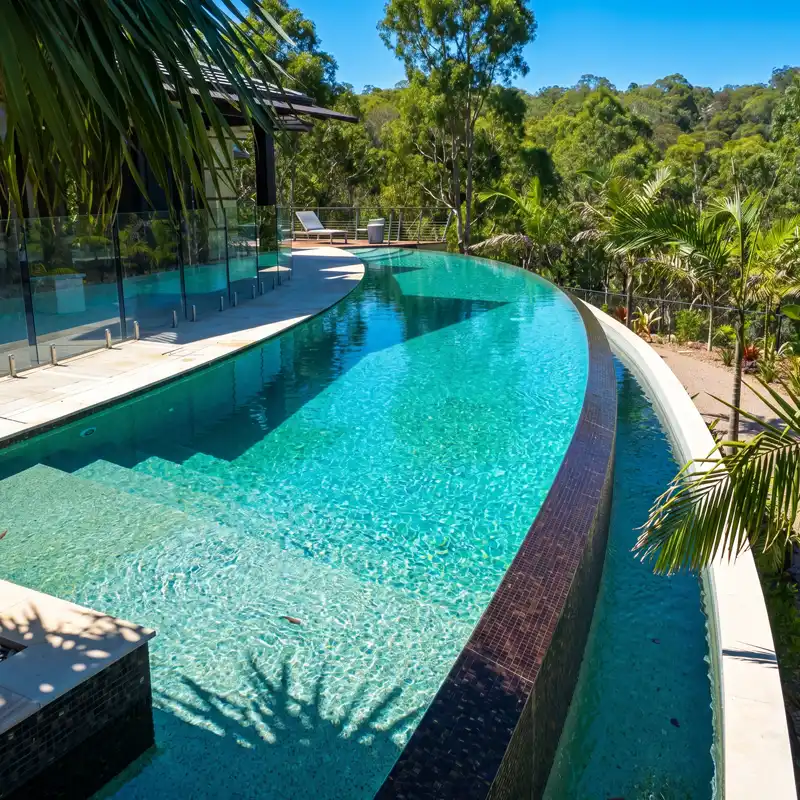 Build a concrete pool with custom curved design on the Sunshine Coast