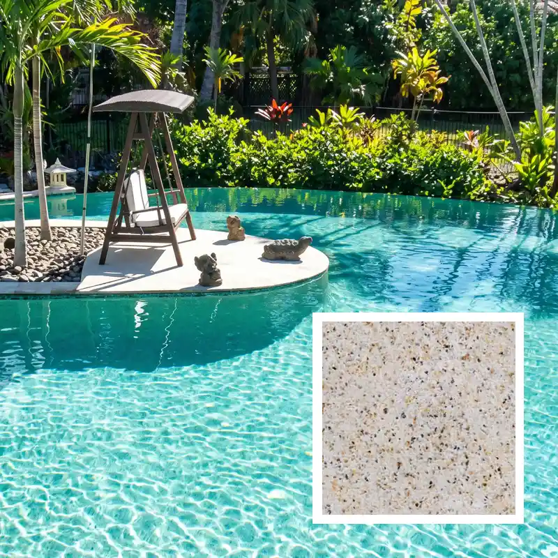 Champagne exposed aggregate concrete pool finish creating soft aqua water tones in a tropical Sunshine Coast swimming pool