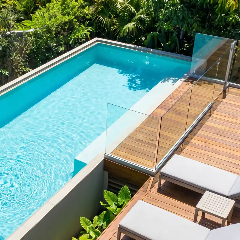 Concrtete lap pool with timber decking and glass fencing on the Sunshine Coast