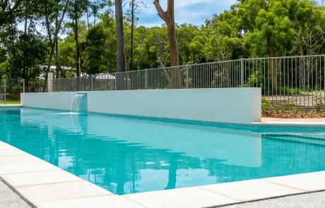 Custom concrete lap pool with feature water blade on the Sunshine Coast