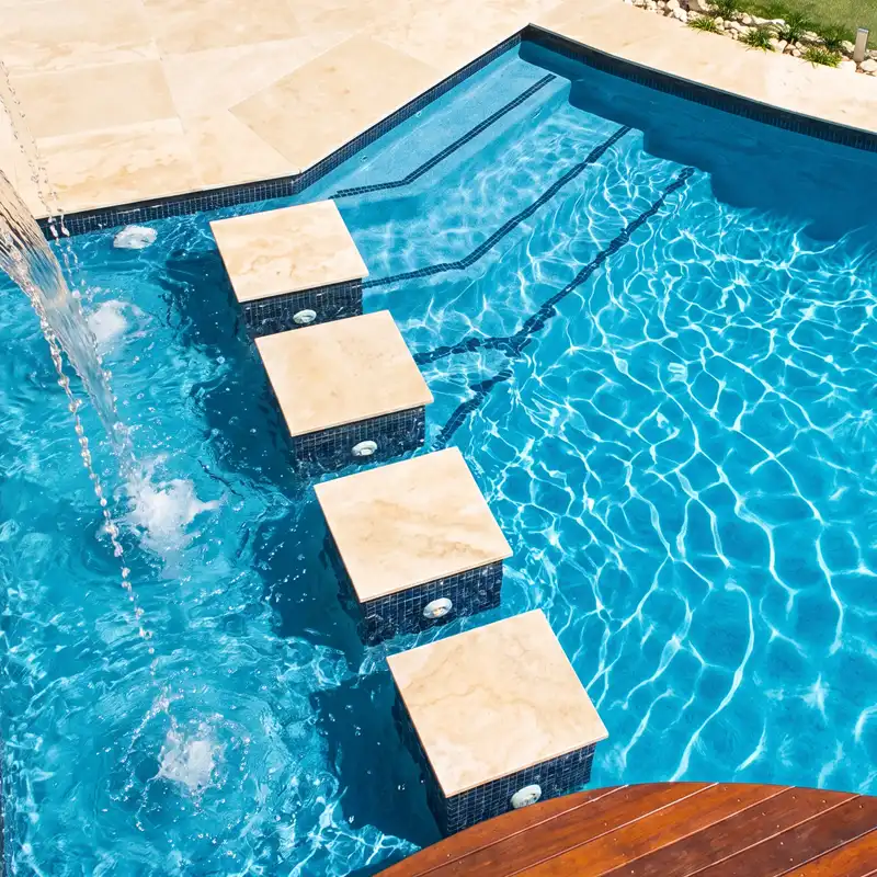 Custom family concrete swimming pool with water feature and entry steps on the Sunshine Coast
