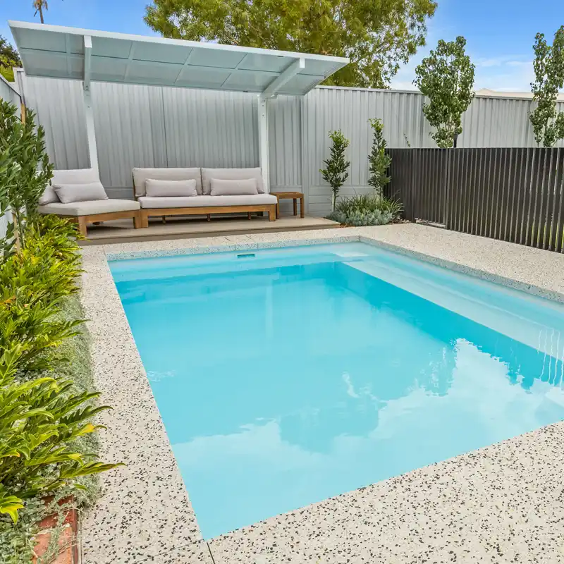 Gympie pool builder project featuring a modern fibreglass swimming pool for a family home.