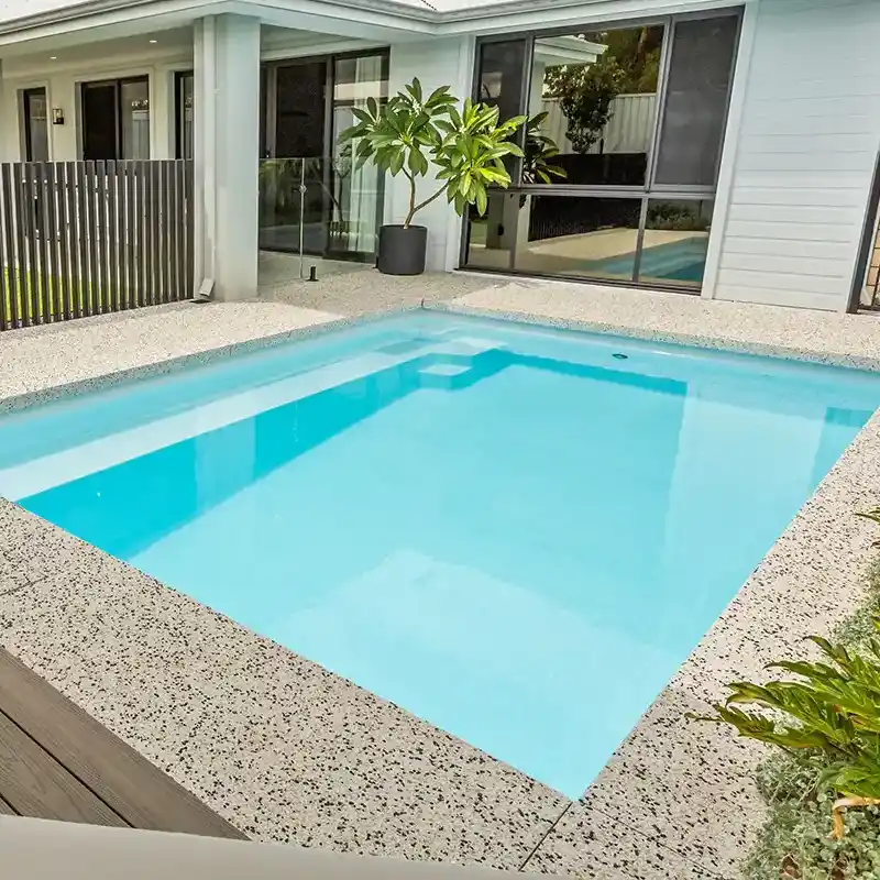 Hamilton Series fibreglass pool with contemporary design and generous swimming area in a modern backyard.