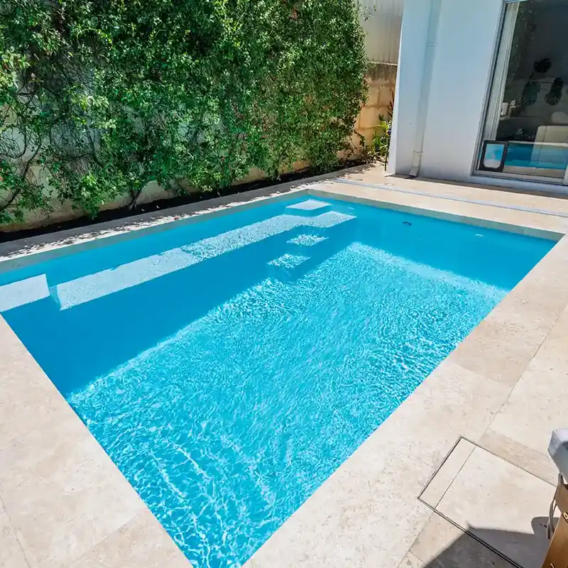 Hamilton SL fibreglass pool installed in a modern Sunshine Coast backyard with entry steps and spacious swimming area.