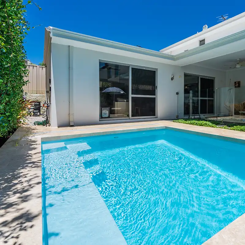 Hamilton SL slimline fibreglass pool with wide entry steps in a modern backyard setting