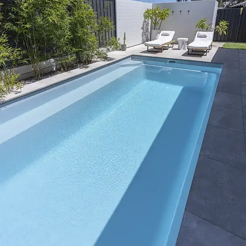 Hampton Lap Pool fibreglass pool with extended swimming lane and modern outdoor entertaining area.