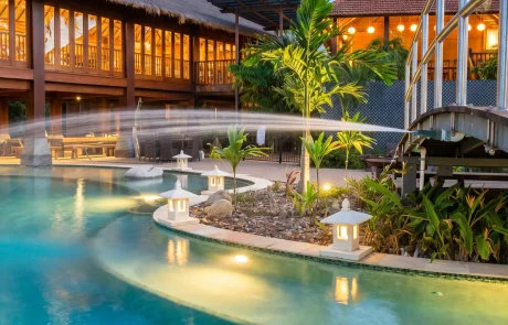 Luxury custom concrete swimming pool with water feature on the Sunshine Coast