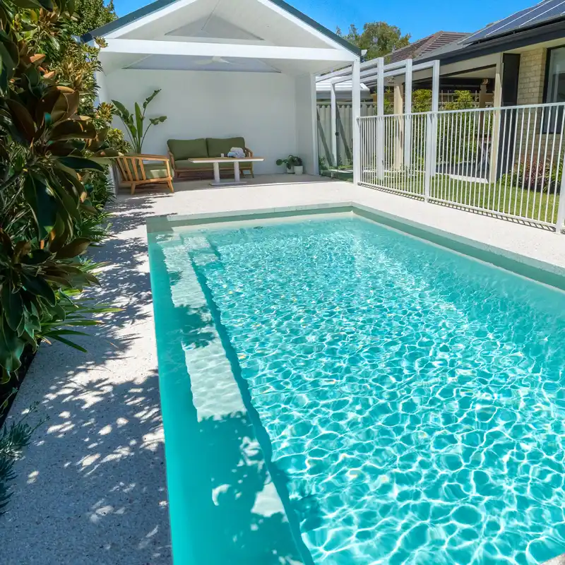 Modern fibreglass swimming pool built by a Maroochydore pool builder for a contemporary Sunshine Coast home