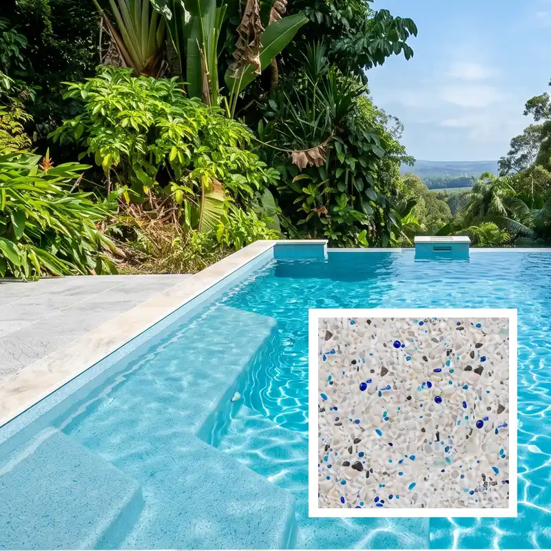 Phoenix Black exposed aggregate concrete pool finish creating vibrant blue water in a luxury Sunshine Coast swimming pool