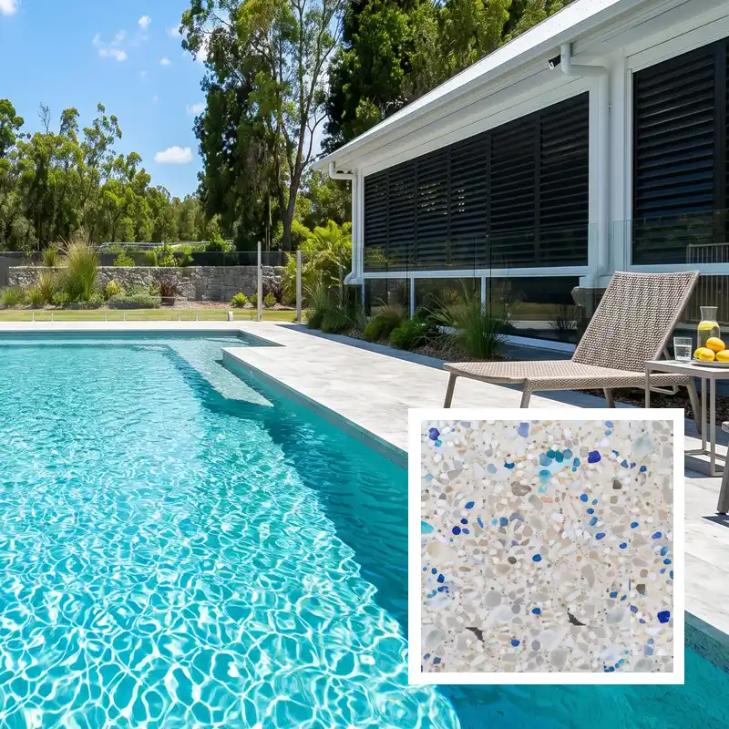 Phoenix Blue exposed aggregate concrete pool finish creating vibrant blue water in a modern Sunshine Coast swimming pool
