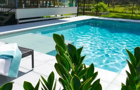 Modern swimming pool with entry ledge and outdoor entertaining area on the Sunshine Coast