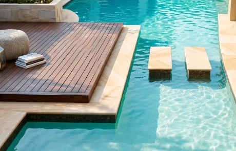 Luxury swimming pool with timber decking and built-in seating on the Sunshine Coast