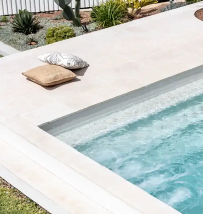 Full-width entry steps in the Sapphire Series modern fibreglass pool